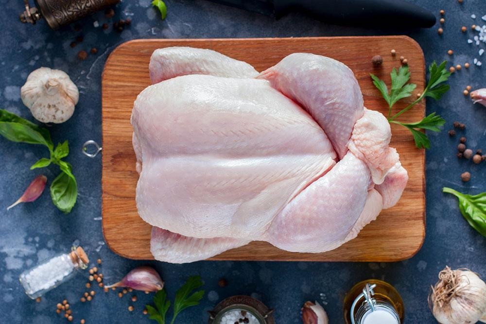 FROZEN FULL CHICKEN  CLEANED AND CUT  1300G+-